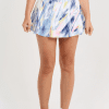 14" Aurora Sky Print Tennis Skort by Sofibella, close up front view on model