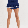 13" Navy Pleated Skort with White Trim by Sofibella, front close up view on model