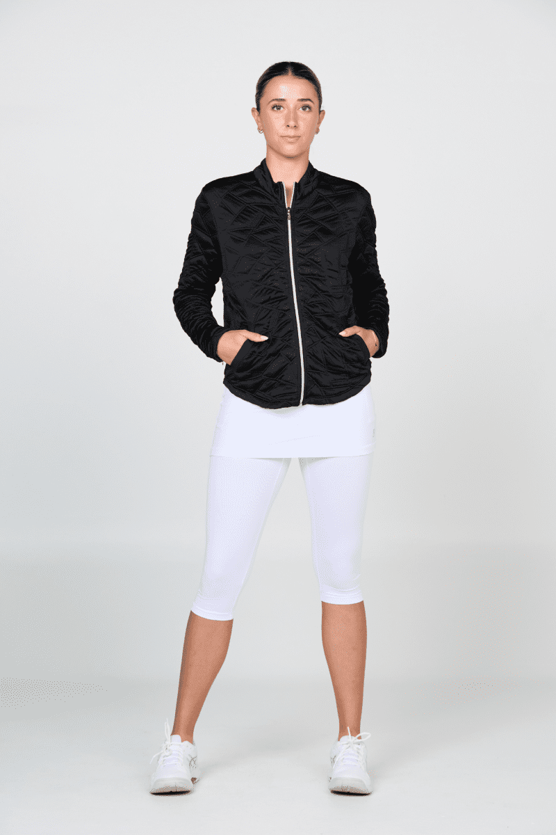 Black quilt jacket with white leggings, front view