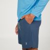 Energy Men's 7" Inseam Tennis Shorts by Sofibella, charcoal, side view on model