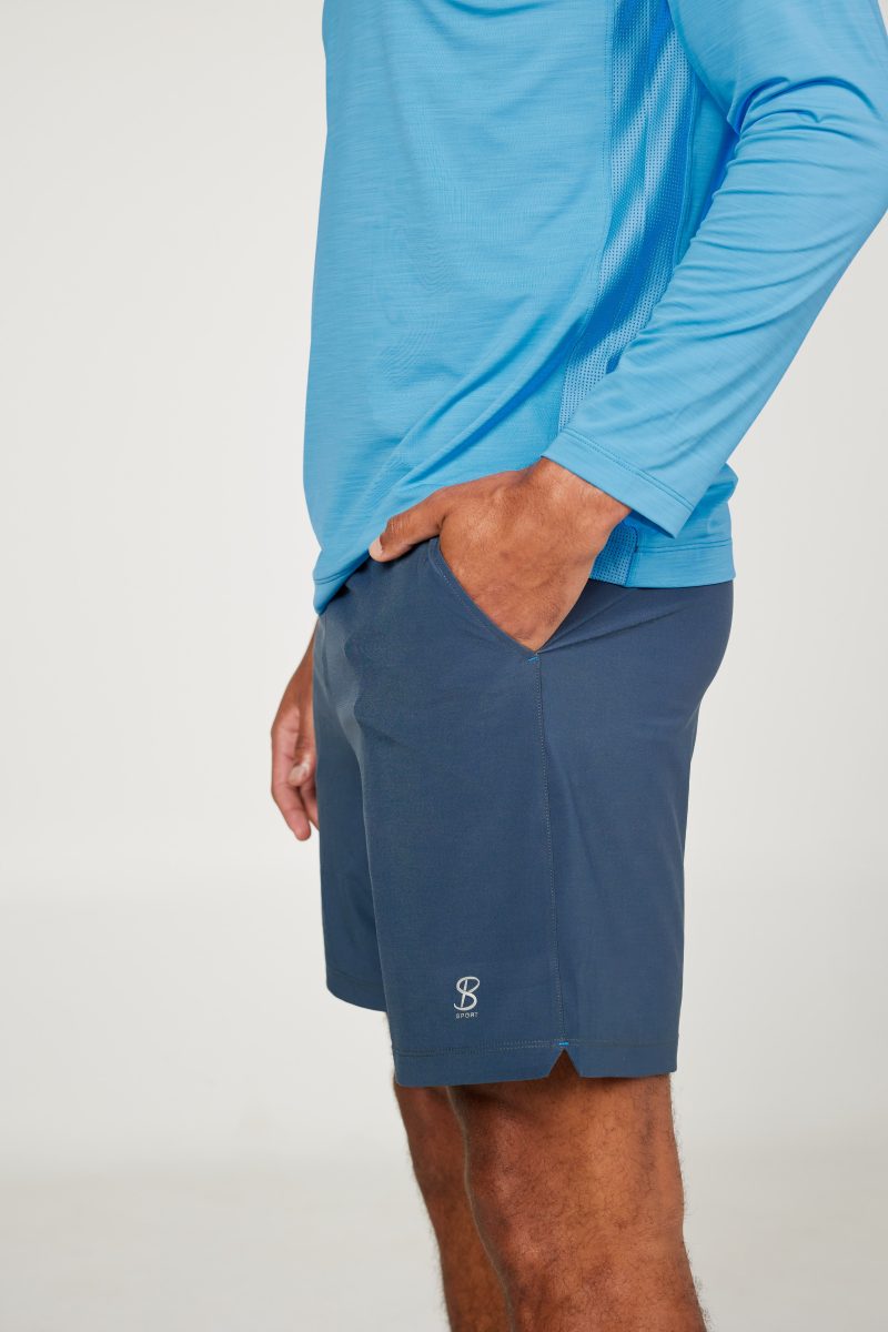 Energy Men's 7" Inseam Tennis Shorts by Sofibella, charcoal, side view on model